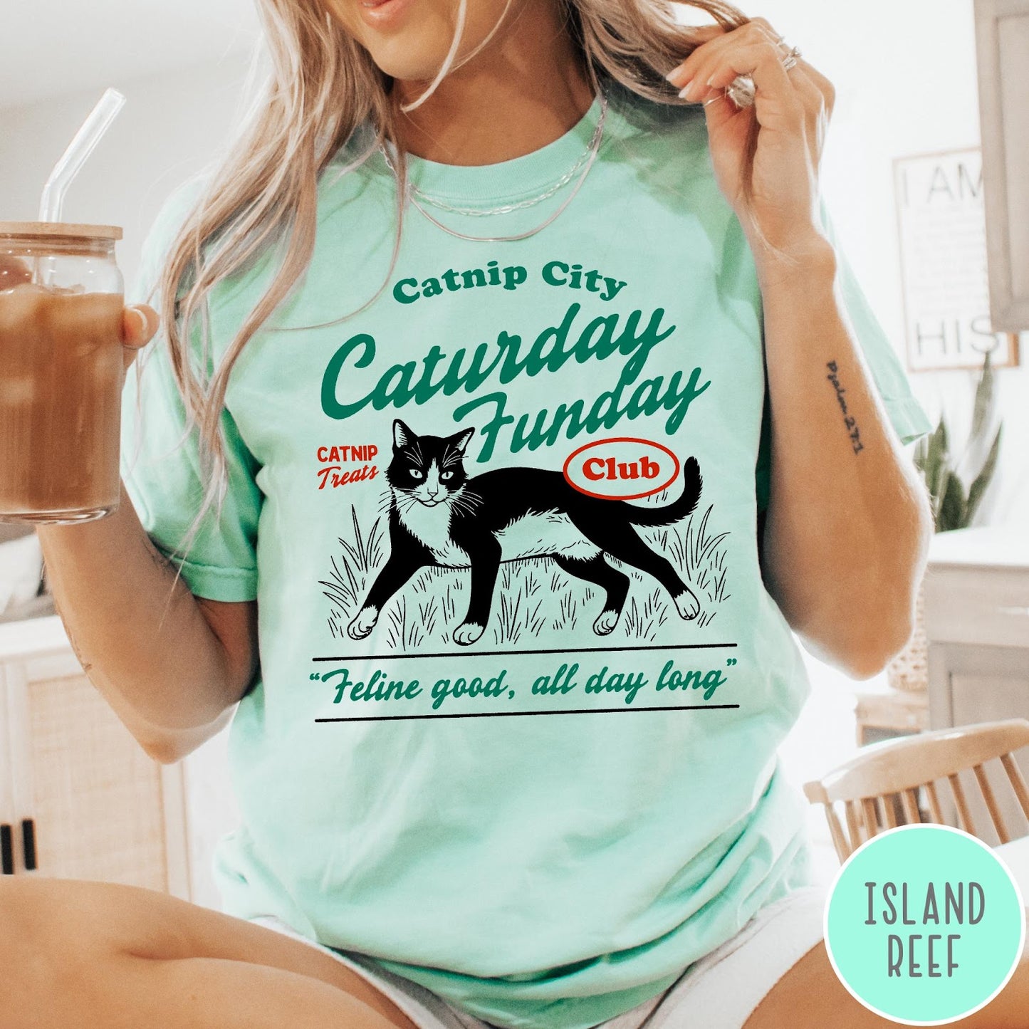 Comfort Colors tee in Island Reef featuring vintage style graphic of a tuxedo cat in grass with text
