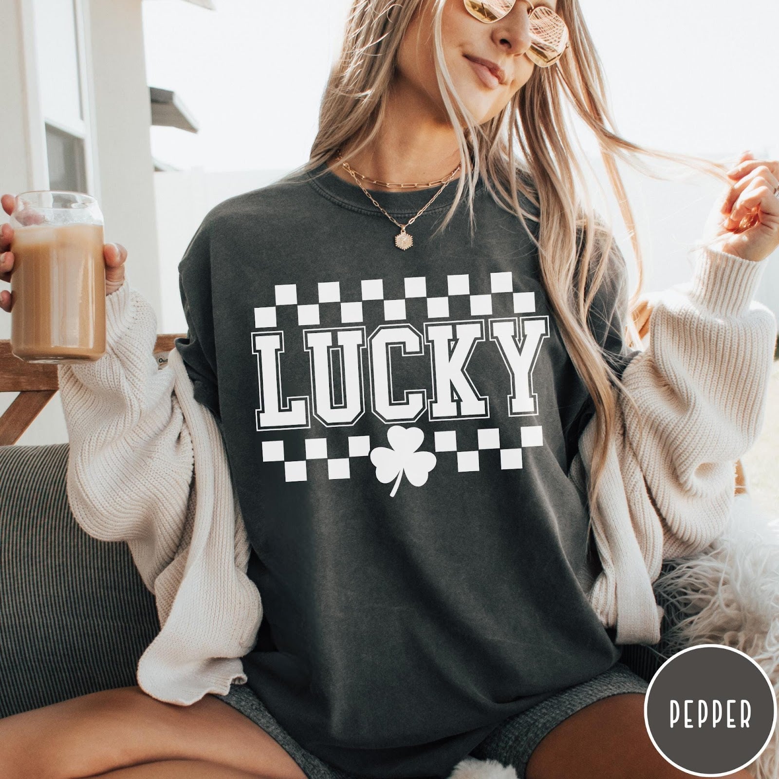 Comfort Colors tee in Pepper featuring checkerboard design with Lucky text and a shamrock graphic