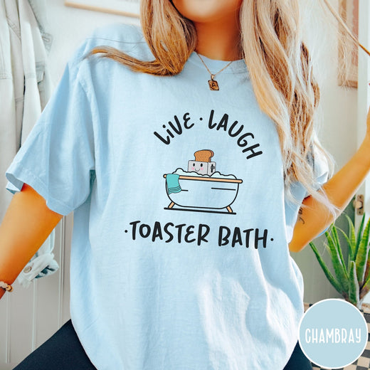 Comfort Colors tee in Chambray featuring cute graphic style of a smiling toaster sitting in a bathtub