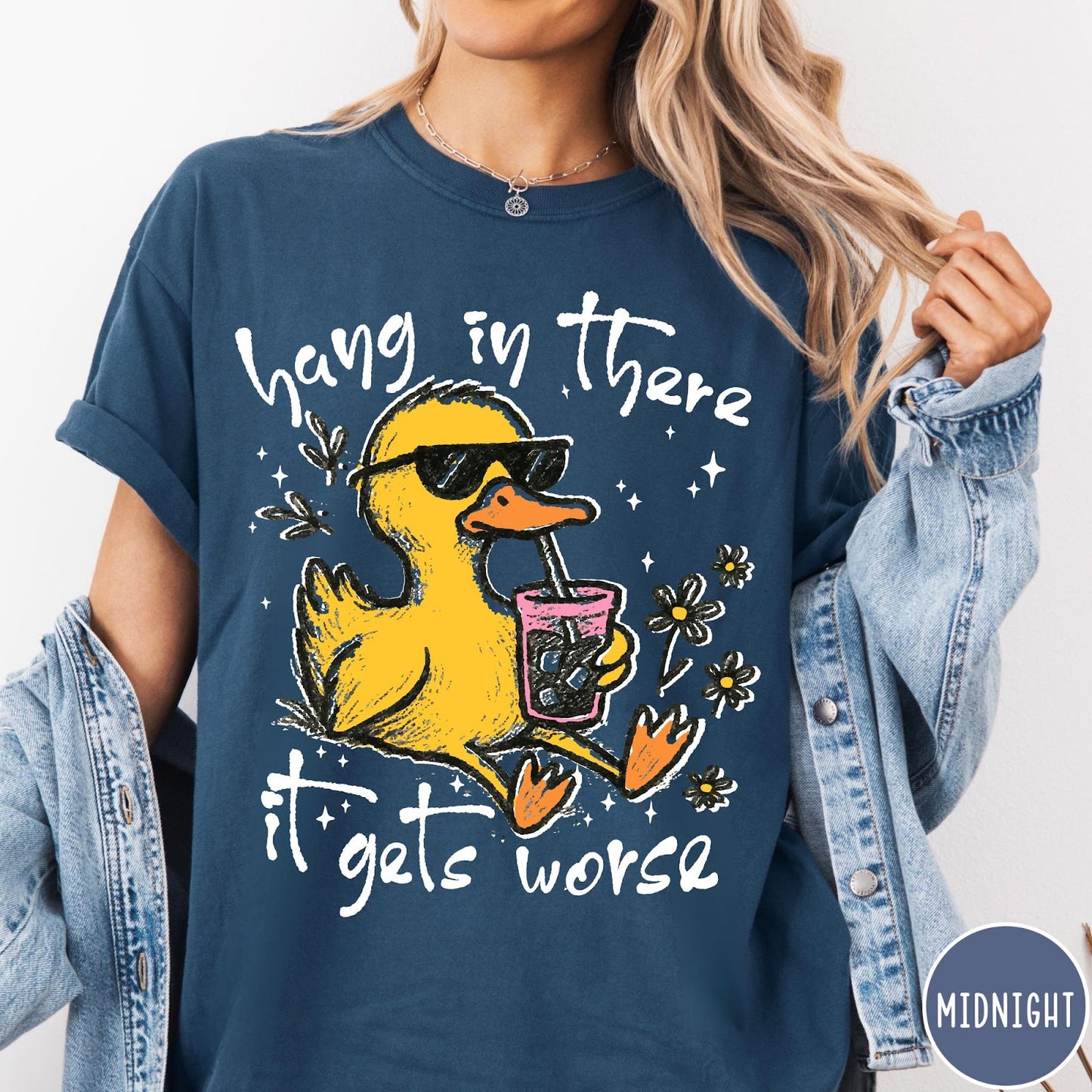 Comfort Colors tee in Midnight featuring illustrated duck wearing sunglasses and drinking iced coffee with floral accents