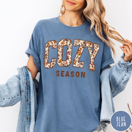 Comfort Colors tee in Blue Jean featuring autumnal floral typography with a cozy season graphic design