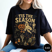 Comfort Colors tee in Black featuring vintage style Halloween icons collage with pumpkin, ghost, skeleton, and potions