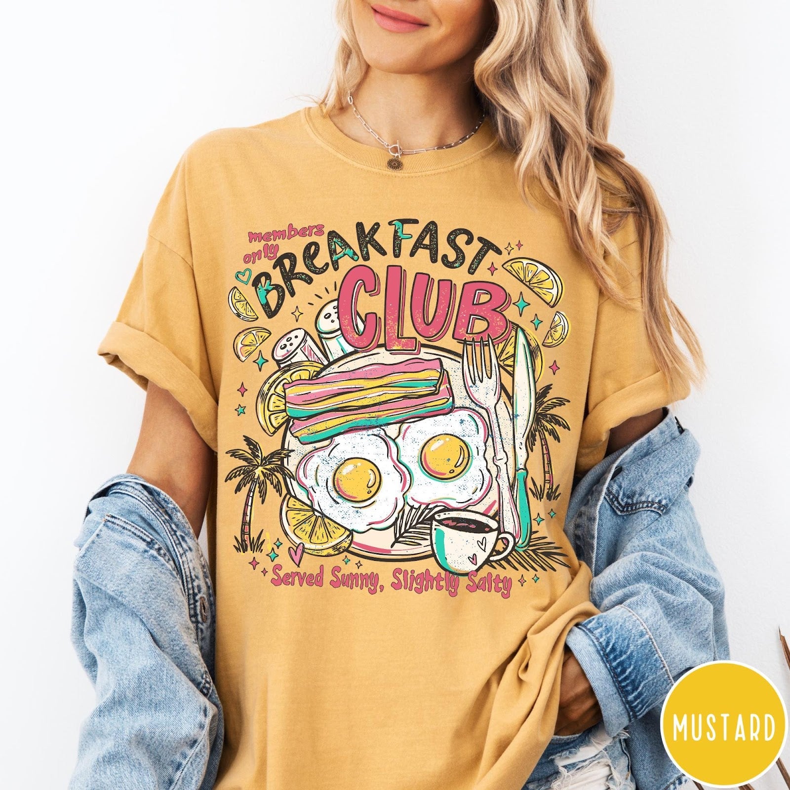 Comfort Colors tee in Mustard featuring retro breakfast food graphic with eggs, bacon, and coffee illustration