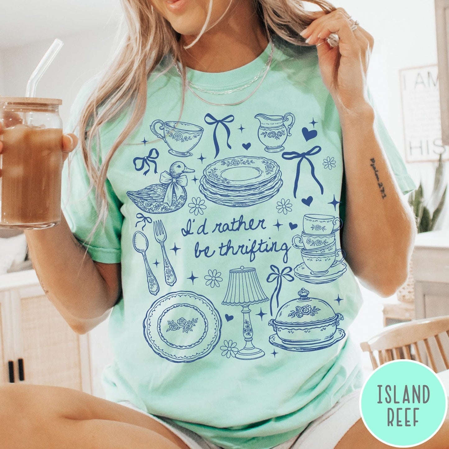 Comfort Colors tee in Island Reef featuring line art graphic of antique home goods and thrifting items