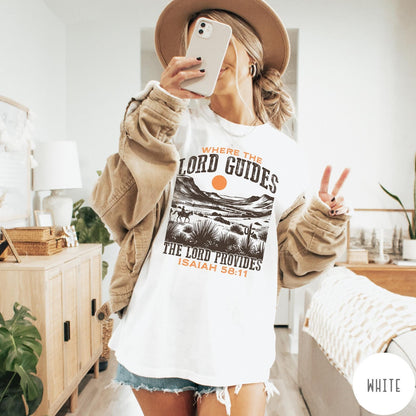 Comfort Colors tee in White featuring desert landscape graphic with a rider and sun design.