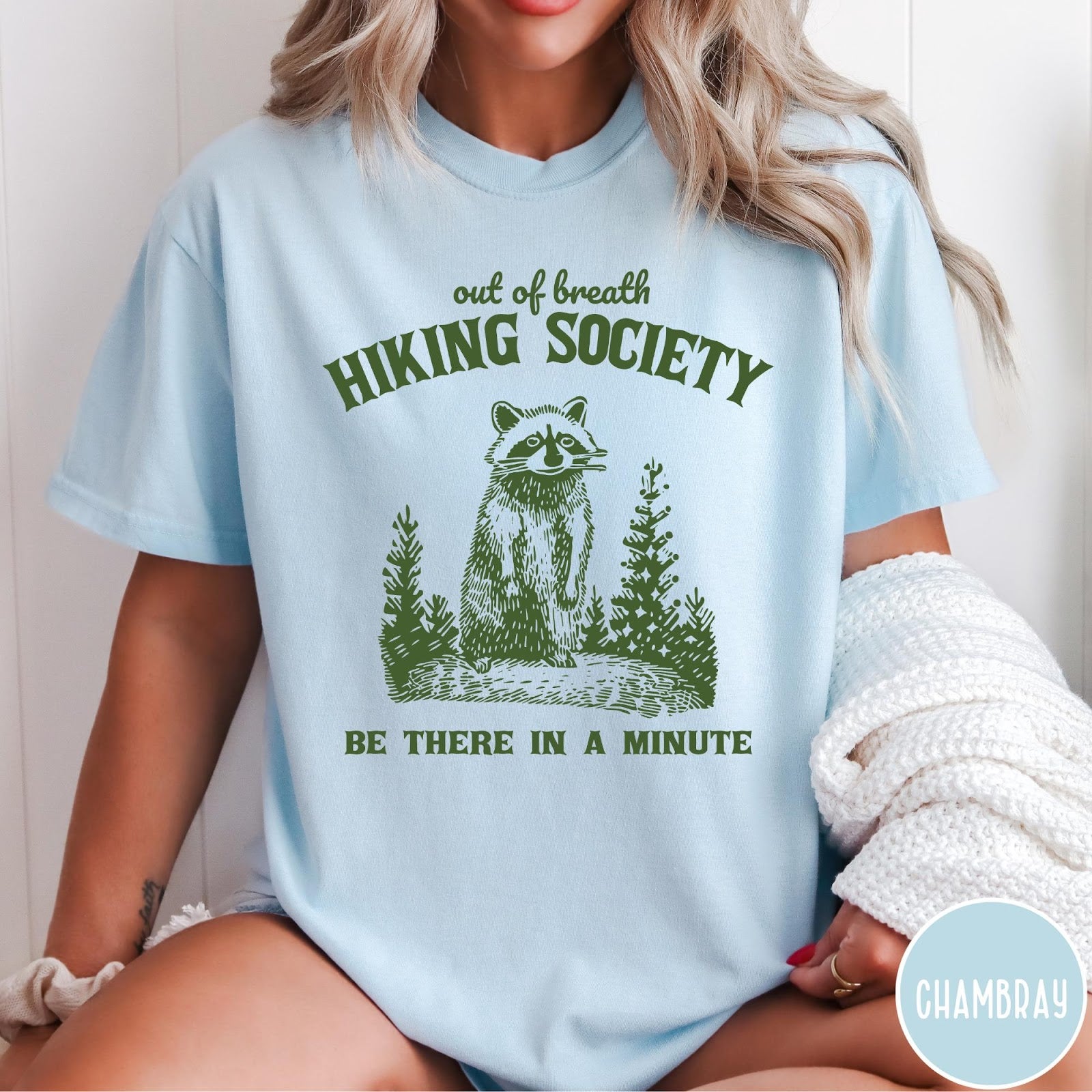 Comfort Colors tee in Chambray featuring outdoor style graphic of a raccoon standing in the forest