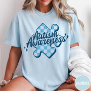 Comfort Colors tee in Chambray featuring casual style with a blue checkered puzzle piece Autism Awareness graphic