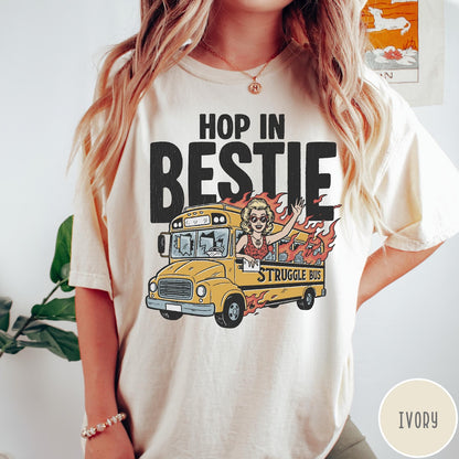 Comfort Colors tee in Ivory featuring retro style graphic of a woman waving from a burning school bus