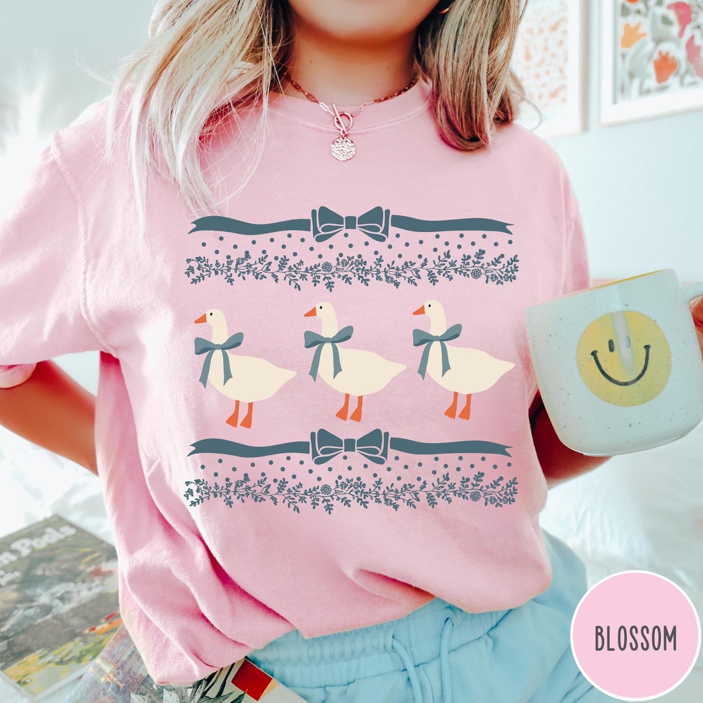 Comfort Colors tee in Blossom featuring vintage style graphic with three geese wearing blue ribbons and floral borders