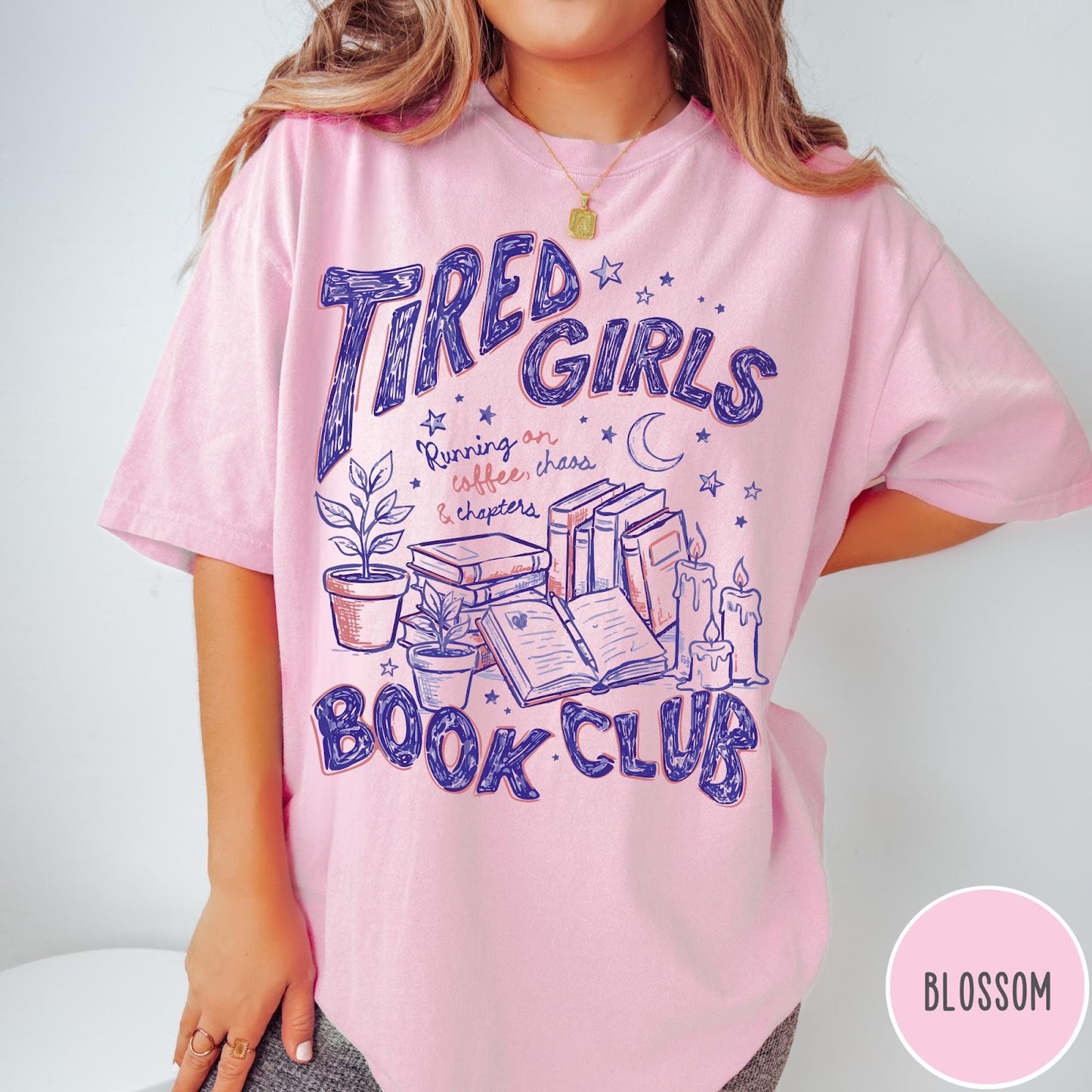 Comfort Colors tee in Blossom featuring illustrated book club graphic with books, plants, candles, and moon stars