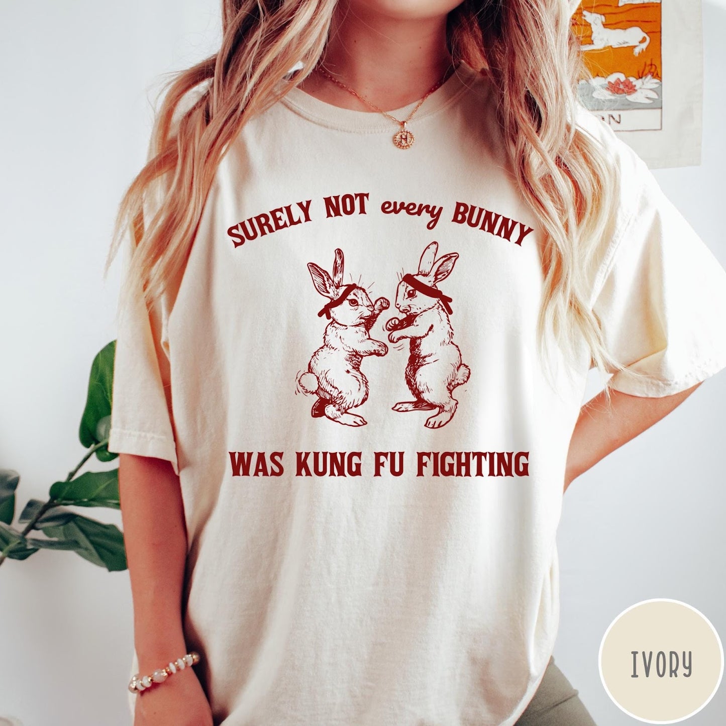 Comfort Colors tee in Ivory featuring vintage style graphic of two rabbits wearing headbands kung fu fighting