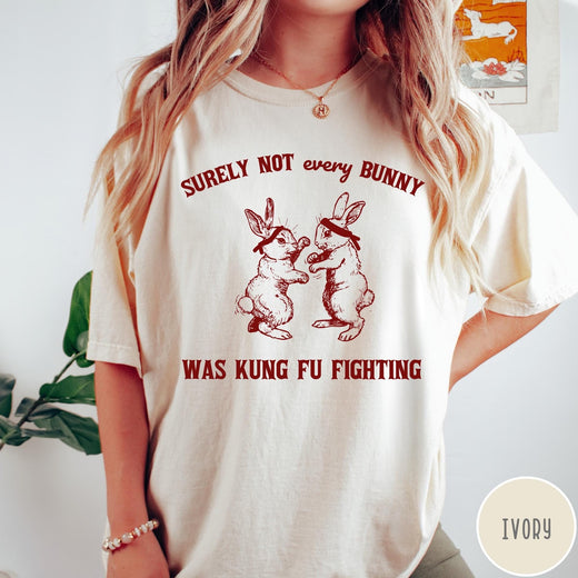 Comfort Colors tee in Ivory featuring vintage style graphic of two rabbits wearing headbands kung fu fighting