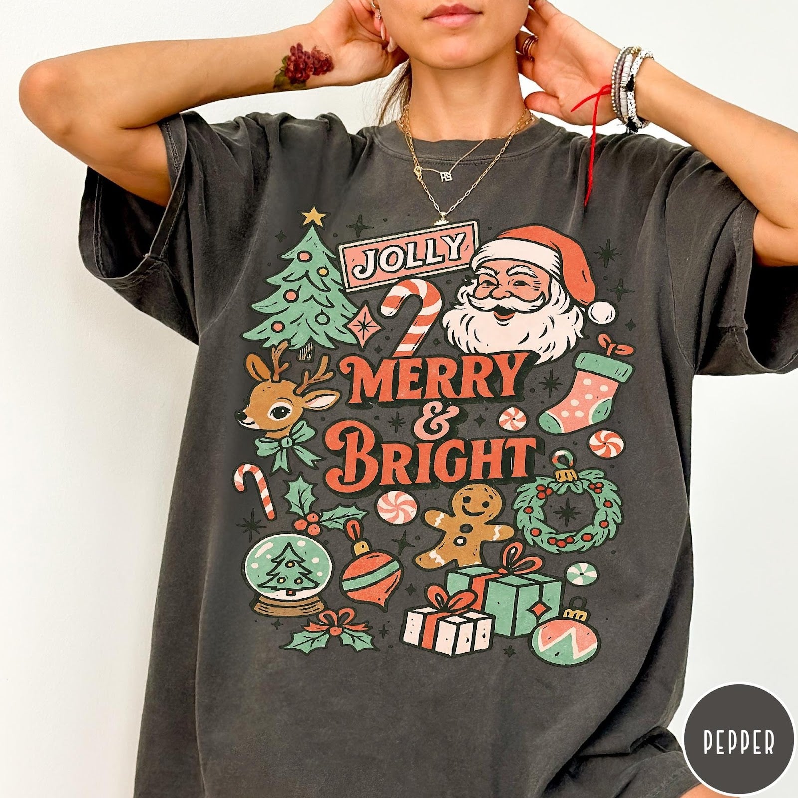 Comfort Colors tee in Pepper featuring retro holiday design with Santa, reindeer, and Christmas icons.