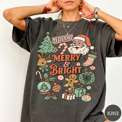 Comfort Colors tee in Pepper featuring retro holiday design with Santa, reindeer, and Christmas icons.