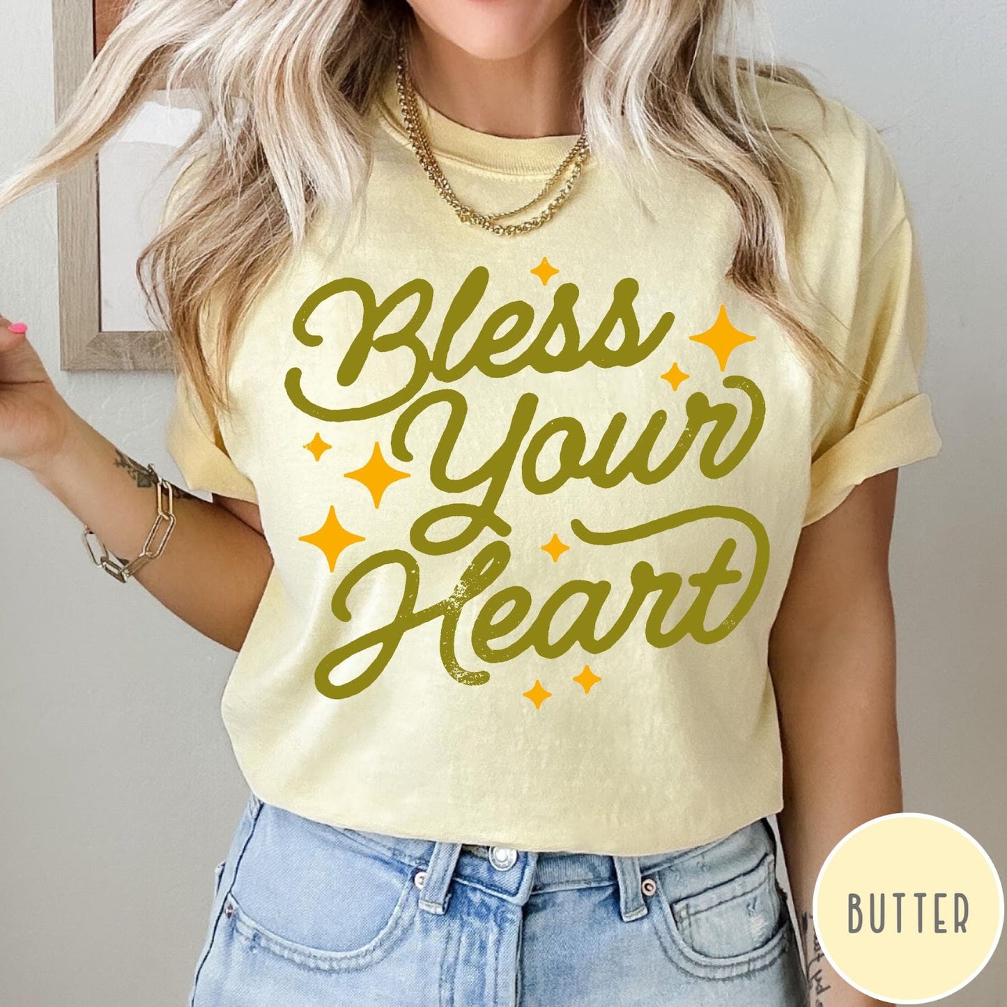 Comfort Colors tee in Butter featuring script lettering and star accents with the phrase Bless Your Heart