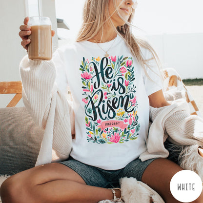 Comfort Colors tee in White featuring religious floral design with He is Risen text graphic