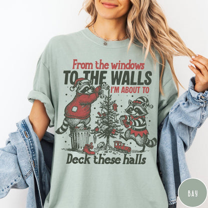 Comfort Colors tee in Bay featuring festive raccoon graphic with Christmas tree and holiday themed text design
