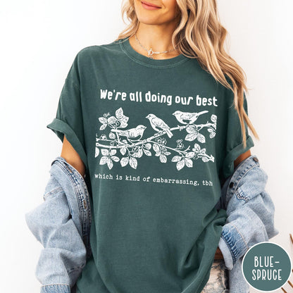 Comfort Colors tee in Blue Spruce featuring graphic illustration of birds on a branch with text.