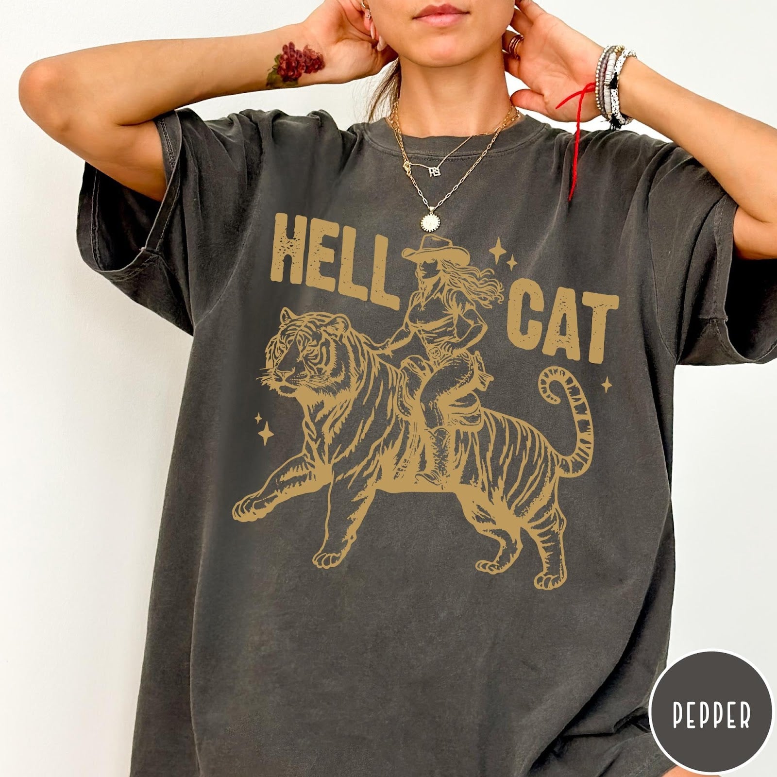 Comfort Colors tee in Pepper featuring western style graphic of a cowgirl riding a large tiger