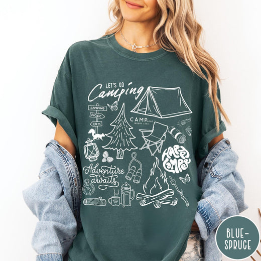 Comfort Colors tee in Blue Spruce featuring retro camping adventure collage graphic with tent, campfire, and outdoor icons