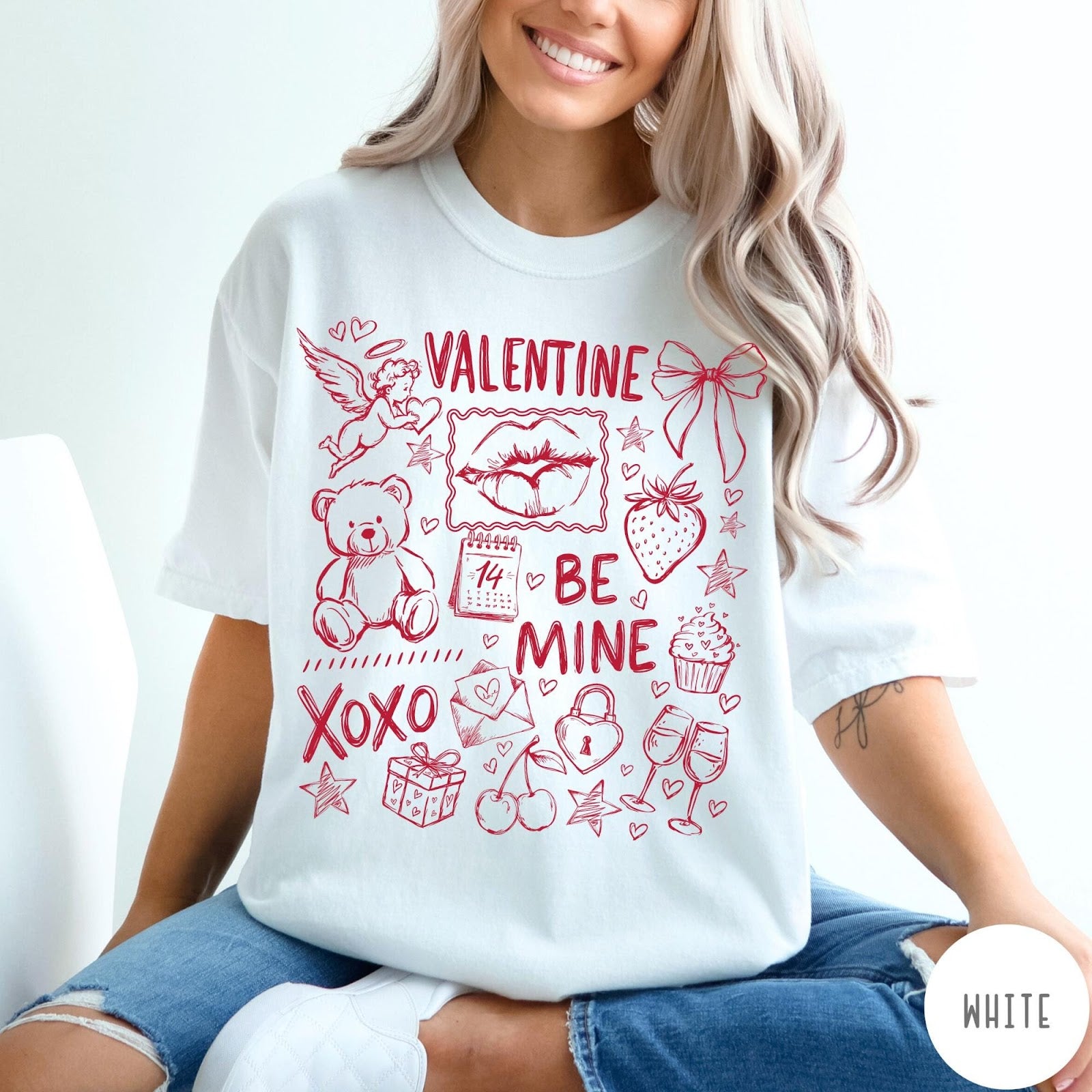 Comfort Colors tee in White featuring sketch style Valentine's Day collage graphic with cupid, bear, and hearts