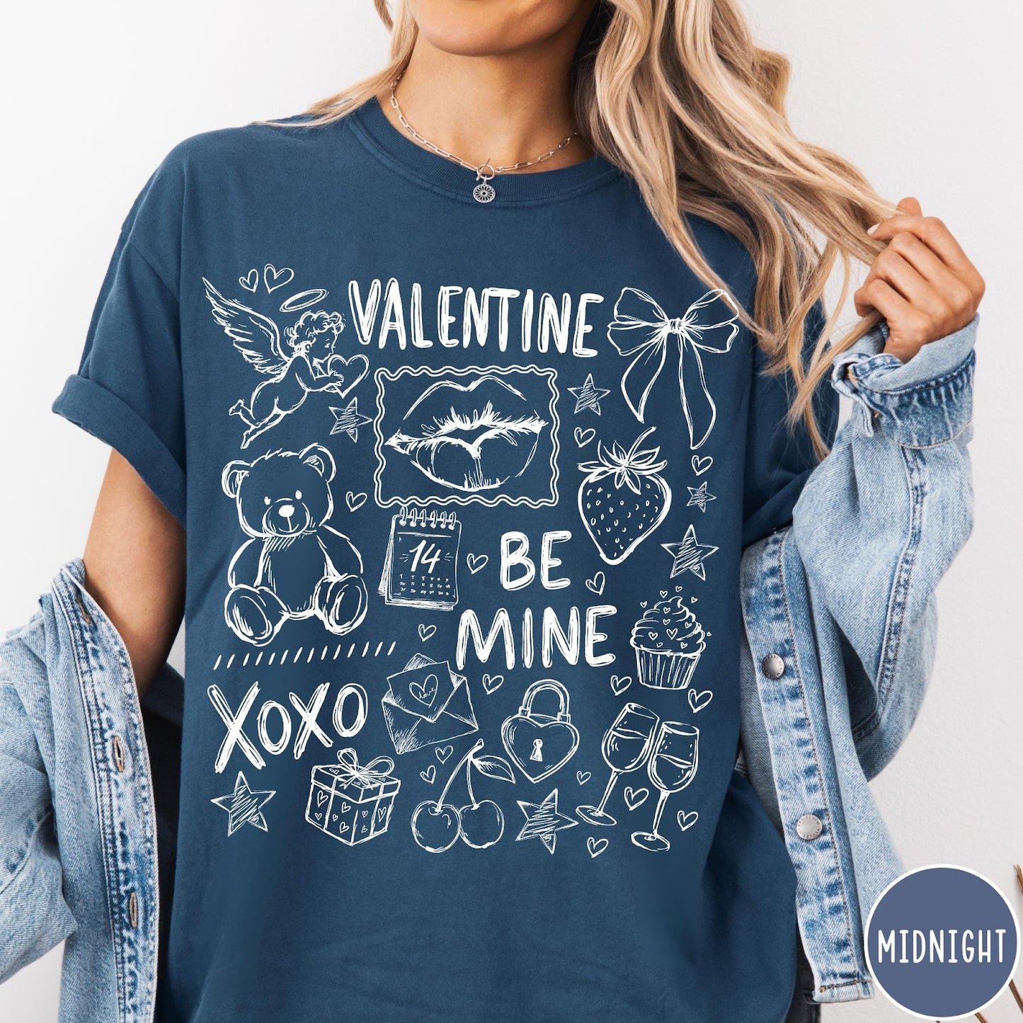 Comfort Colors tee in Midnight featuring Valentine's Day collage graphic with cupid, teddy bear, and romantic symbols