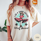 Comfort Colors tee in Ivory featuring cowgirl design style with a dancing woman in a pink dress