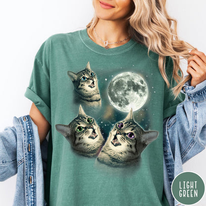 Comfort Colors tee in Light Green featuring retro design with three cats looking up at the moon