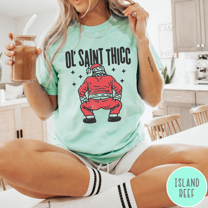 Comfort Colors tee in Island Reef featuring festive graphic style Santa Claus doing a dance move with stars