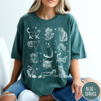 Comfort Colors tee in Blue Spruce featuring vintage style graphic illustration of various cats and celestial stars