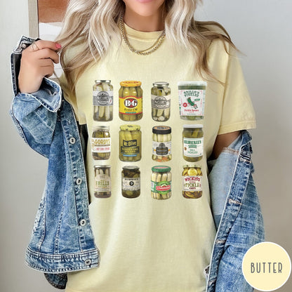 Comfort Colors tee in Butter featuring graphic design of various pickle jars arranged in a grid pattern