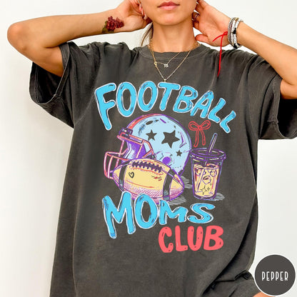 Comfort Colors tee in Pepper featuring football lifestyle graphic with helmet, football, and iced coffee drink design