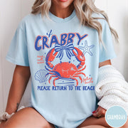 Comfort Colors tee in Chambray featuring beachy crab graphic with bow, starfish, seashell, and coastal text