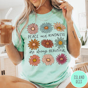 Comfort Colors tee in Island Reef featuring floral design with Peace and Kindness are always beautiful text graphic