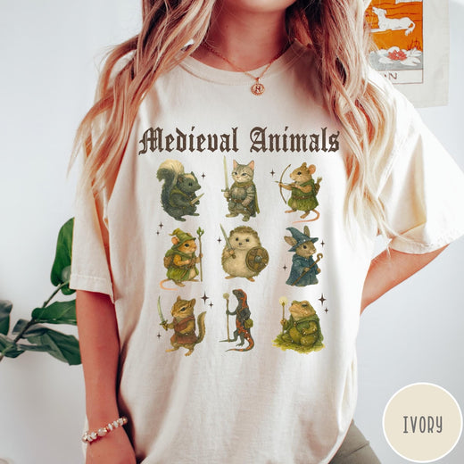 Comfort Colors tee in Ivory featuring medieval fantasy style graphic of nine various animals in knightly attire