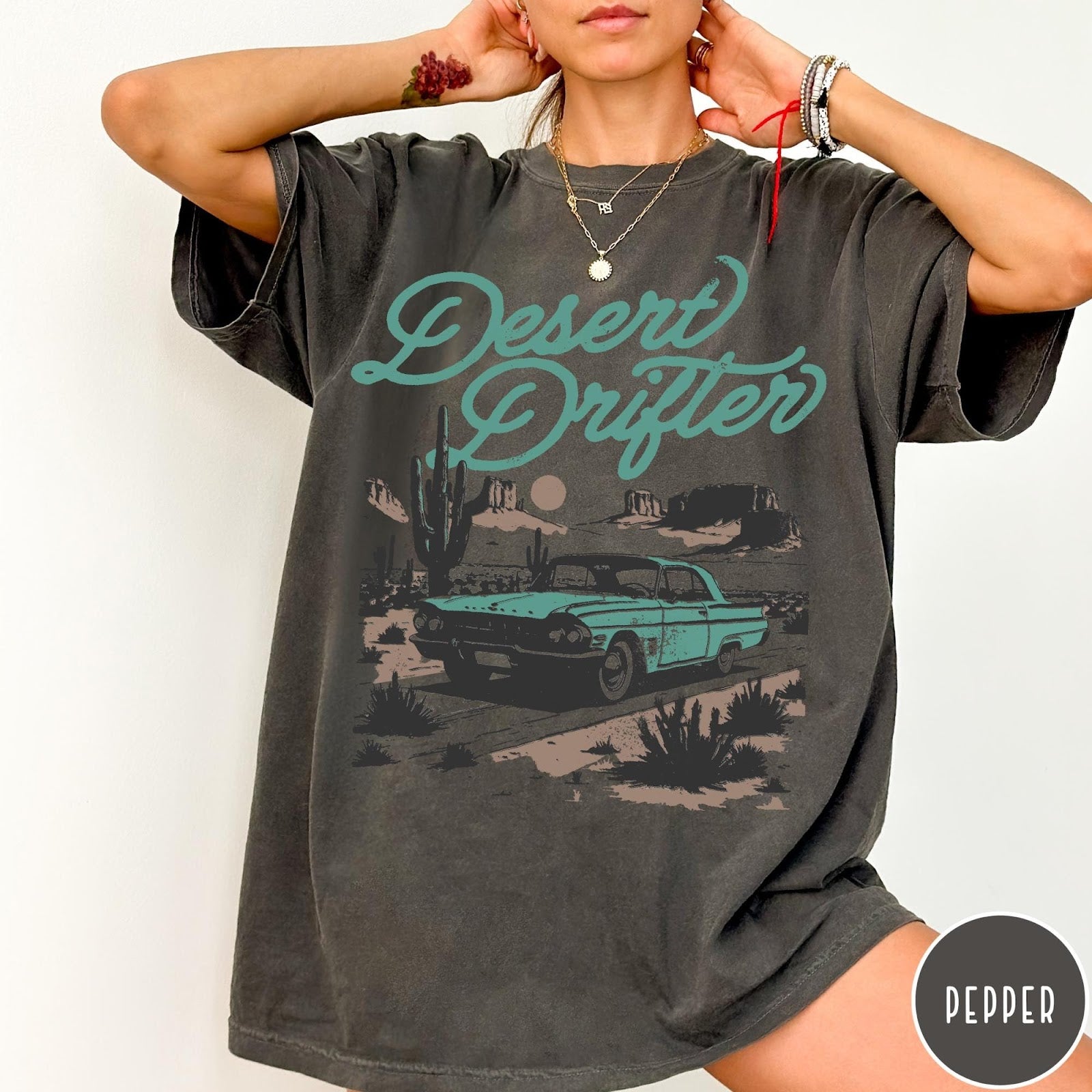 Comfort Colors tee in Pepper featuring vintage style graphic of a classic car in a desert landscape