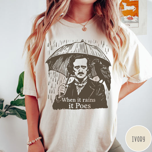 Comfort Colors tee in Ivory featuring graphic illustration of Edgar Allan Poe with umbrella and raven