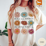 Comfort Colors tee in Ivory featuring floral design with Peace and Kindness are always beautiful text graphic