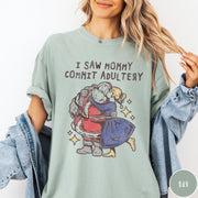 Comfort Colors tee in Bay featuring vintage style graphic of Santa Claus kissing a woman under stars