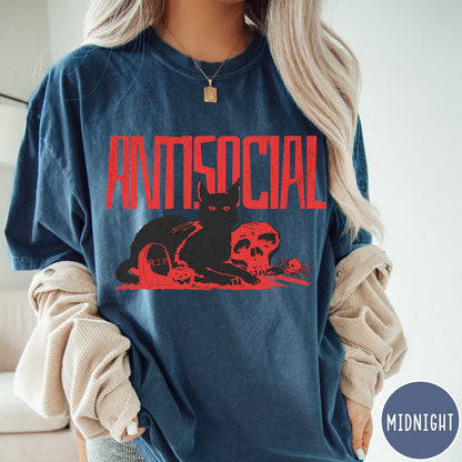 Comfort Colors tee in Midnight featuring retro graphic design of a black cat with skull and tombstone