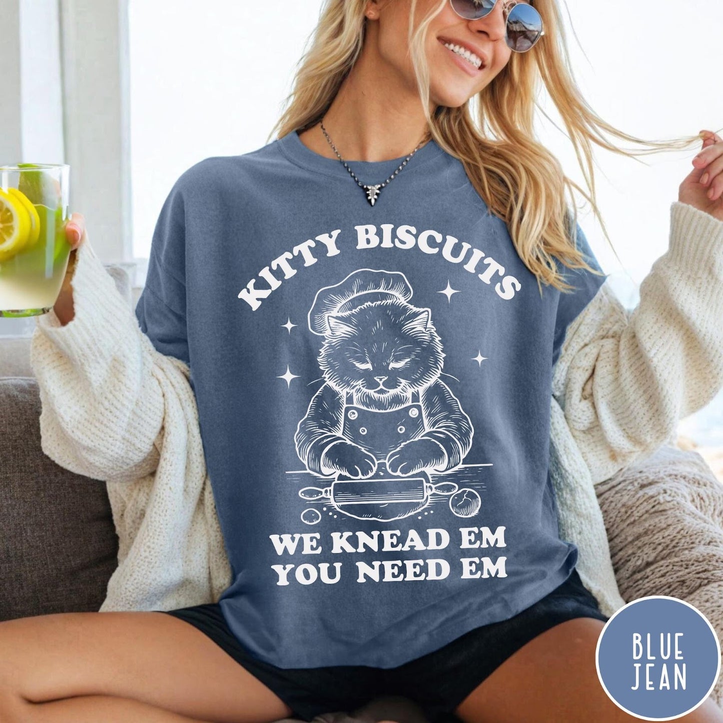 Comfort Colors tee in Blue Jean featuring cat baking biscuits graphic with chef hat and rolling pin illustration