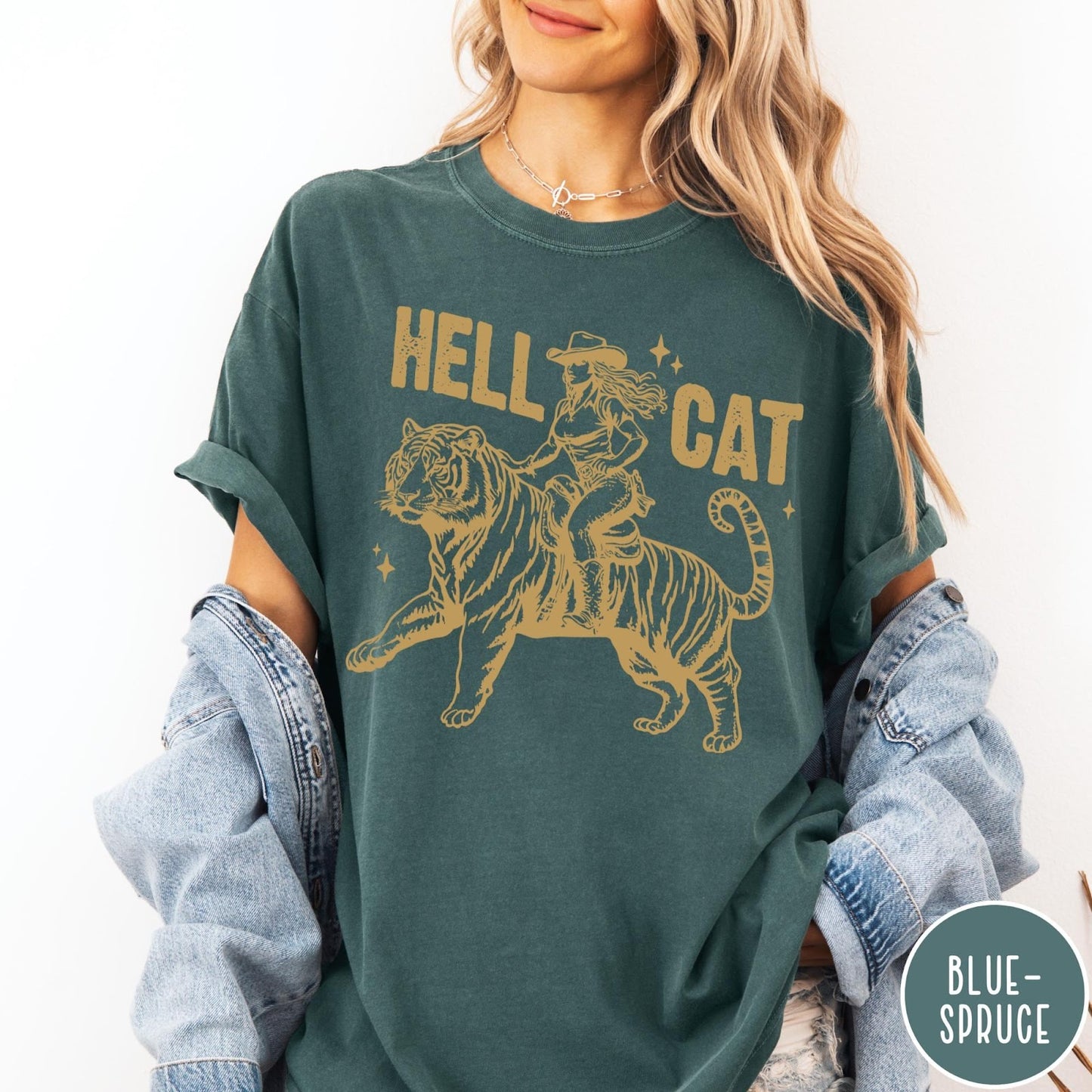 Comfort Colors tee in Blue Spruce featuring western style graphic of a cowgirl riding a large tiger