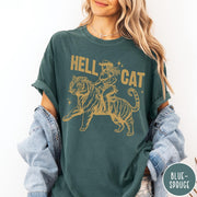 Comfort Colors tee in Blue Spruce featuring western style graphic of a cowgirl riding a large tiger