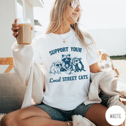Comfort Colors tee in White featuring illustration style graphic of a raccoon, opossum, and skunk wearing sunglasses