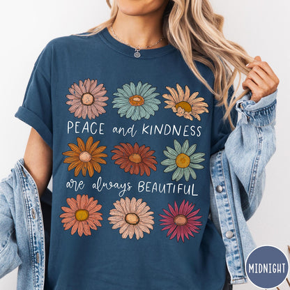 Comfort Colors tee in Midnight featuring floral style graphic with daisies and text Peace and Kindness are always beautiful