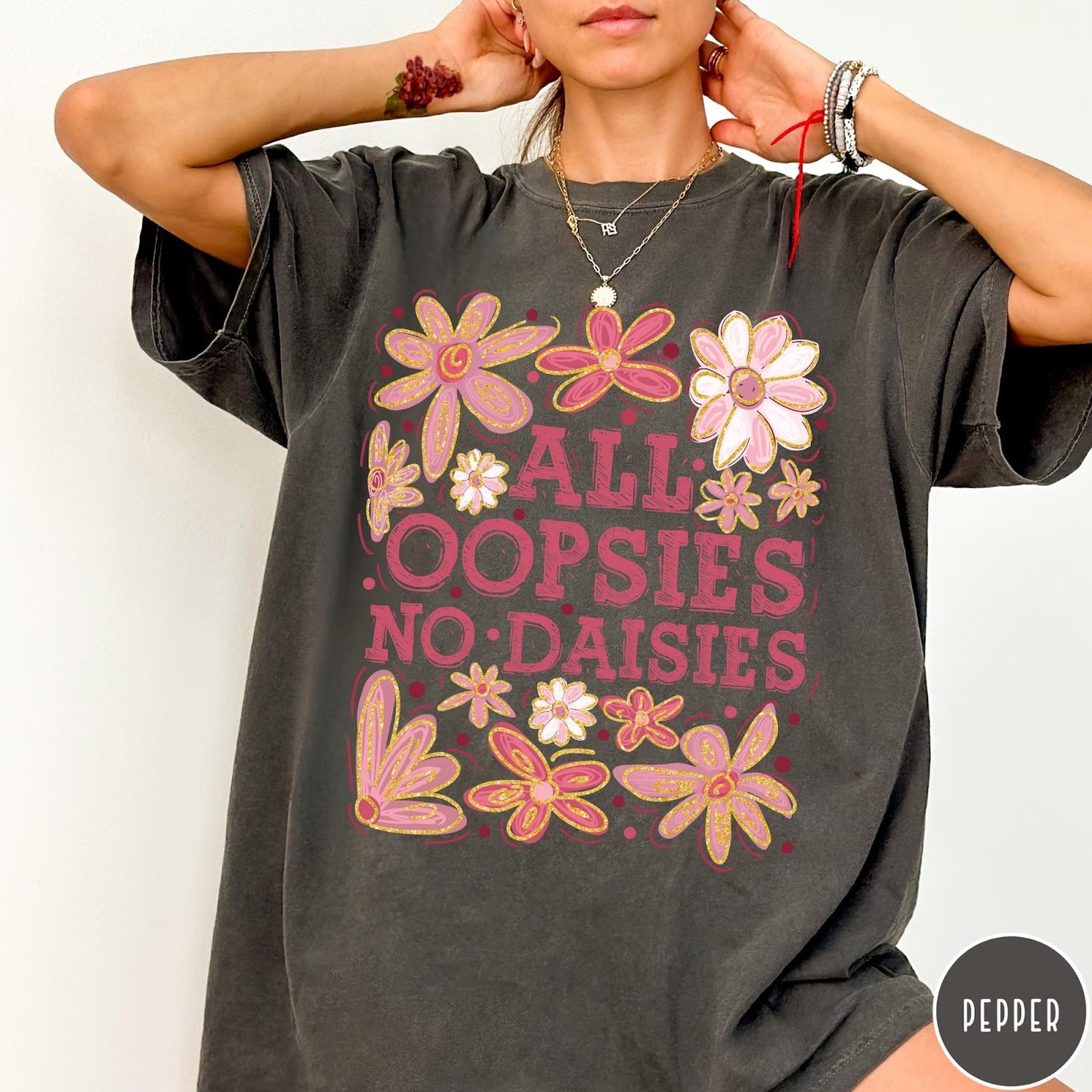 Comfort Colors tee in Pepper featuring floral design with funny quote All Oopsies No Daisies text graphic