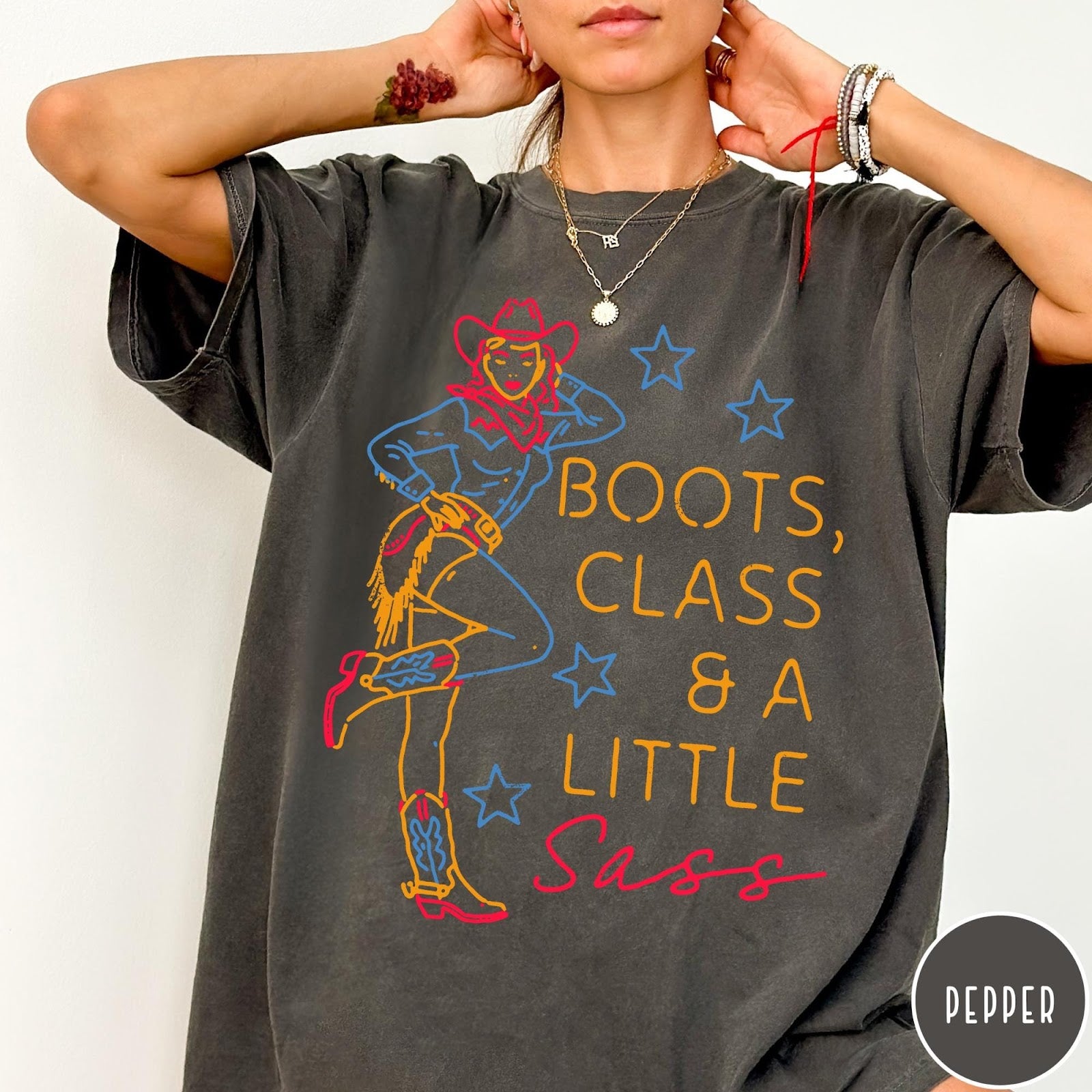 Comfort Colors tee in Pepper featuring retro cowgirl design with boots and text Boots, Class & A Little Sass