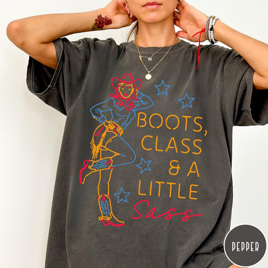 Comfort Colors tee in Pepper featuring retro cowgirl design with boots and text Boots, Class & A Little Sass