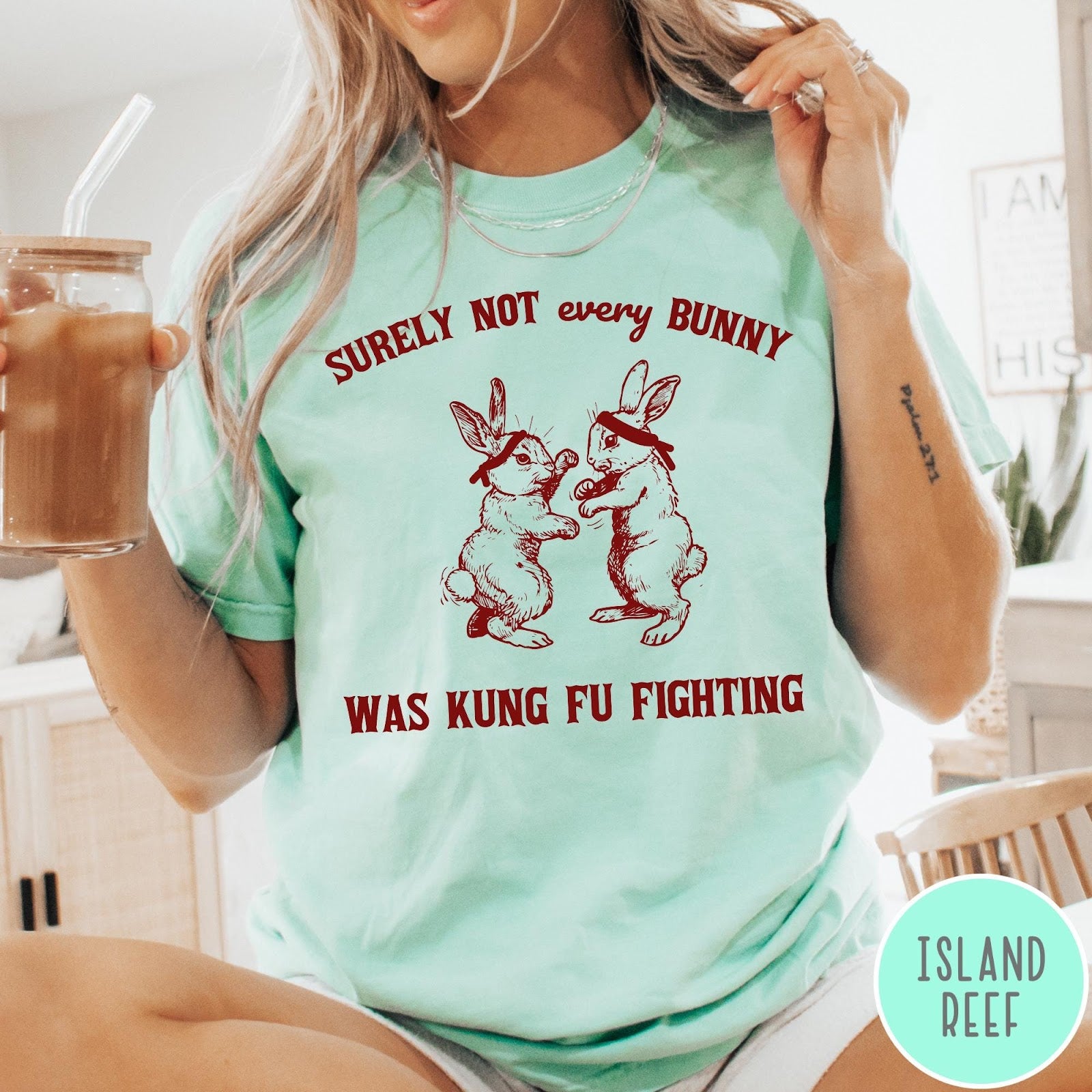 Comfort Colors tee in Island Reef featuring vintage style graphic of two rabbits wearing headbands kung fu fighting