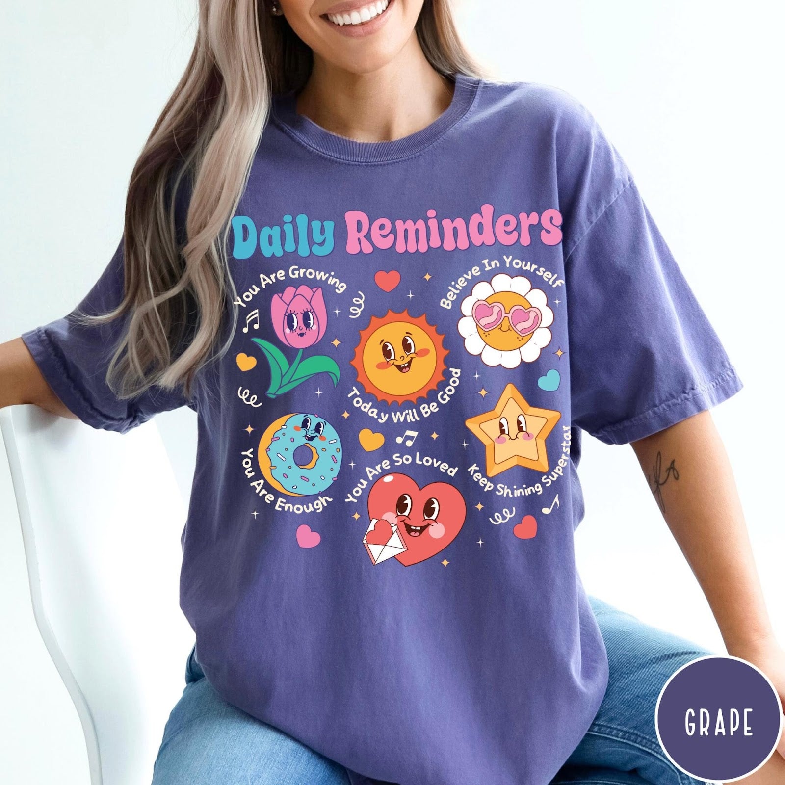 Comfort Colors tee in Grape featuring retro mascot graphic with daily affirmations and cute cartoon characters